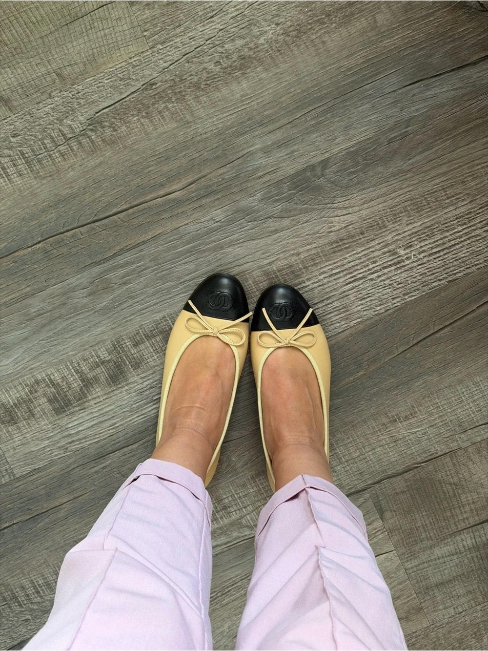 CHANEL Two-Tone Leather Ballet Flats in Cream and Black